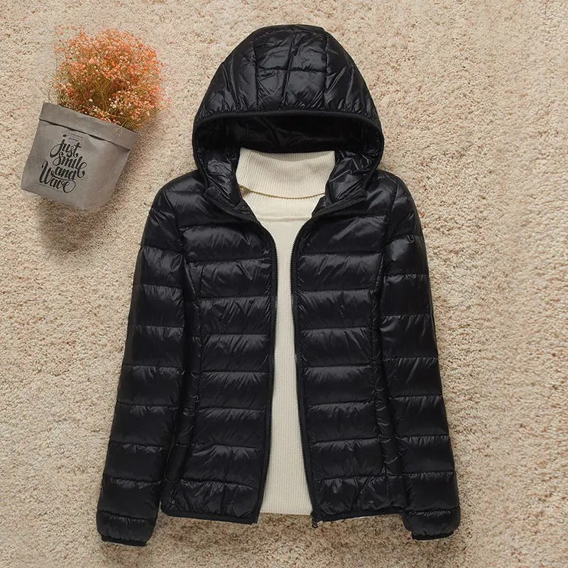 Naisten kevyt tikattu huppurinen liivi